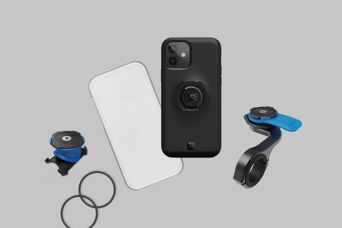 Quad Lock -kiinnitys on integroitu puhelimen suojakuoreen. Vasemmalla kuminauhoilla kiinnitettävä stemmipidike. Oikealla ruuvattava tankopidike.